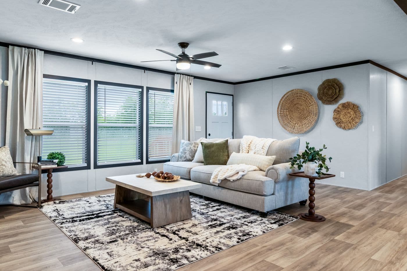 The ODYSSEY Living Room. This Manufactured Mobile Home features 4 bedrooms and 2 baths.