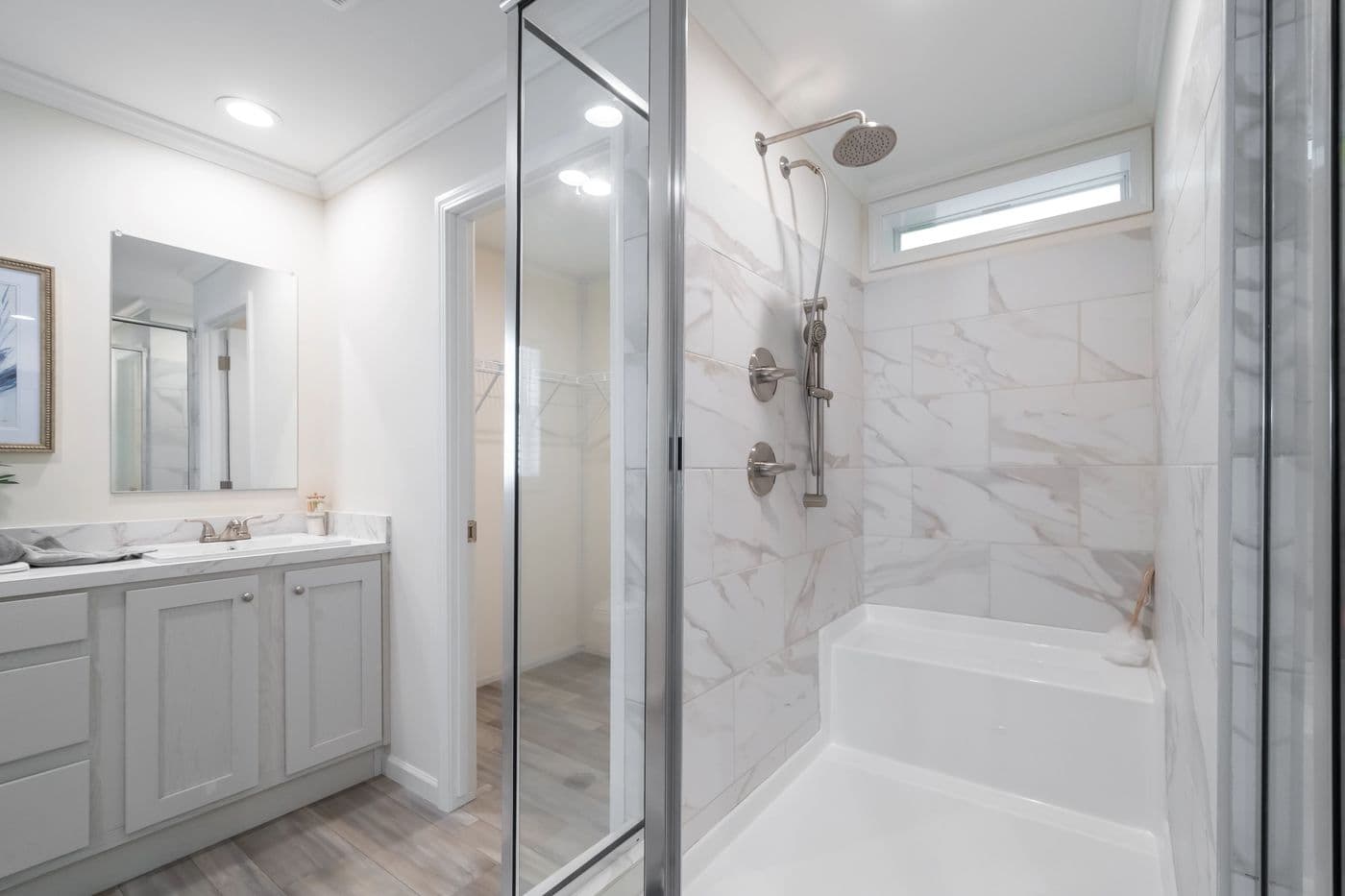 The 4230 "CLEARWATER" 7632 Primary Bathroom. This Manufactured Mobile Home features 4 bedrooms and 2 baths.