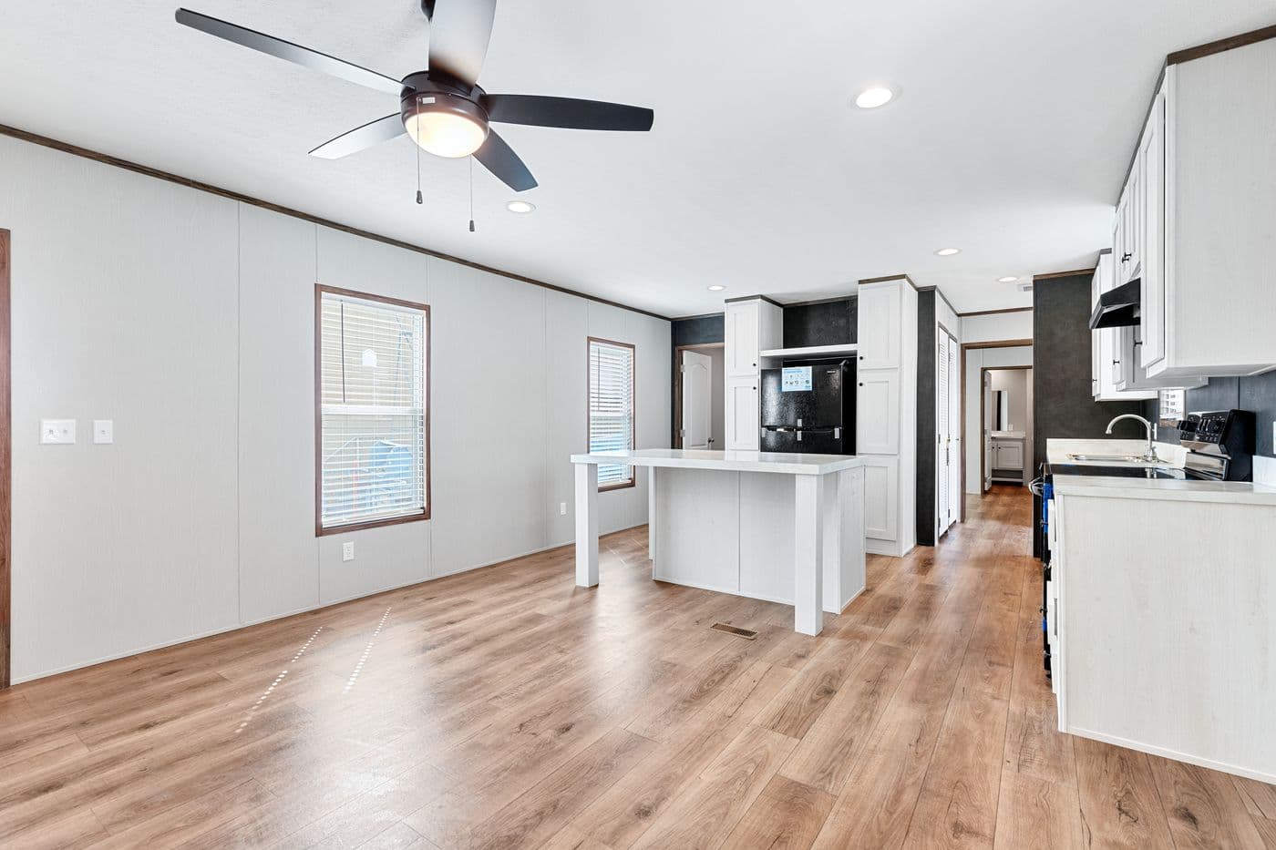 The HOMESTEAD 16683A Kitchen. This Manufactured Mobile Home features 3 bedrooms and 2 baths.