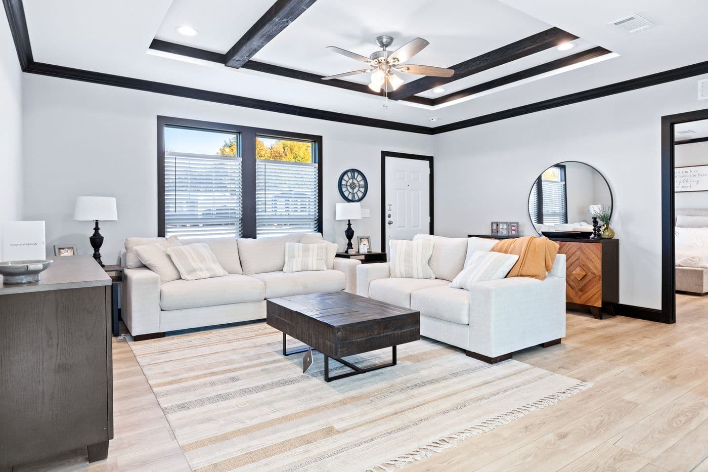 The THE LOUIS Living Room. This Manufactured Mobile Home features 4 bedrooms and 3 baths.