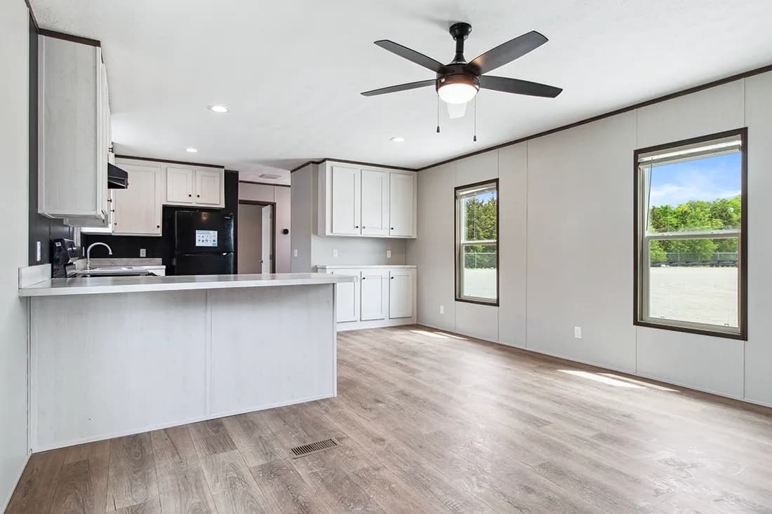 The HOMESTEAD 16562A Kitchen. This Manufactured Mobile Home features 2 bedrooms and 2 baths.