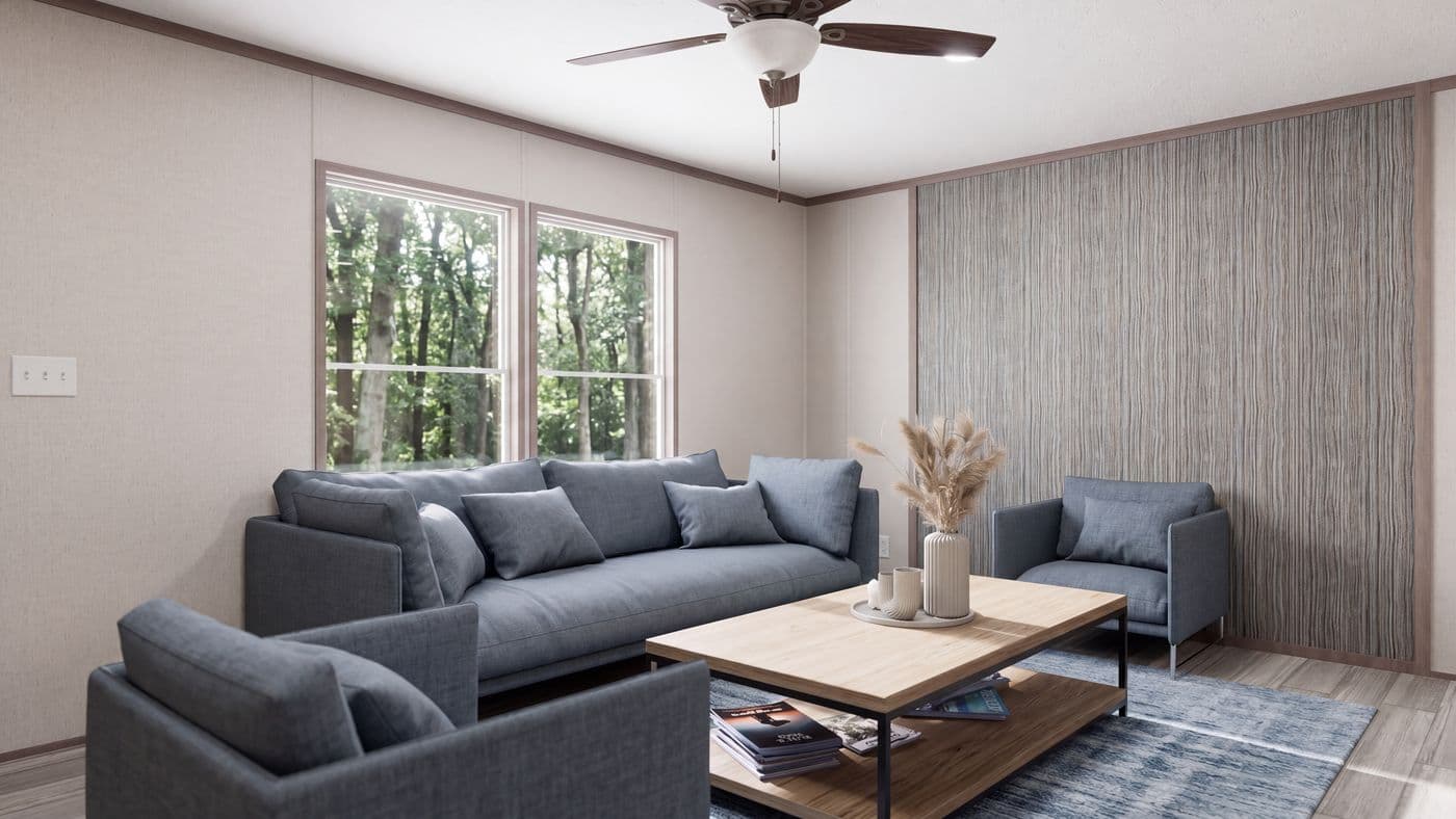 The THE MOUNTAINEER 60 Living Room. This Manufactured Mobile Home features 3 bedrooms and 2 baths.