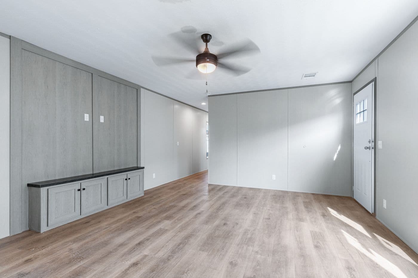 The RESOLUTION 16763H Living Room. This Manufactured Mobile Home features 3 bedrooms and 2 baths.