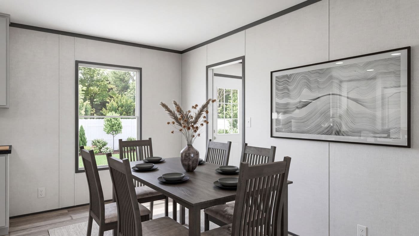 The THE MOUNTAINEER 56 Dining Area. This Manufactured Mobile Home features 3 bedrooms and 2 baths.