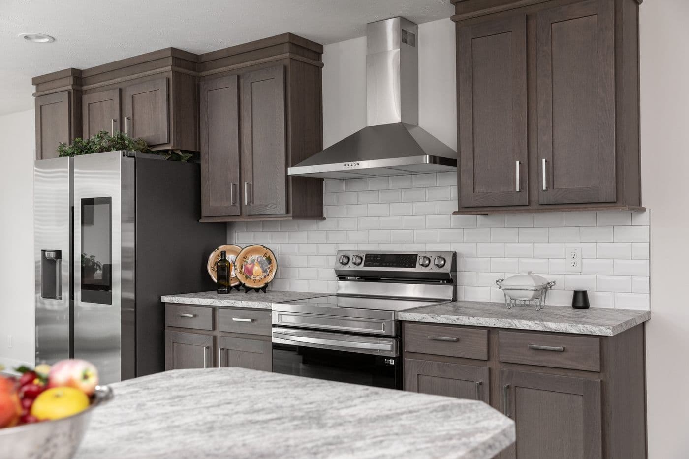 The HILL ST/5628-MS020-1 SECT Kitchen. This Manufactured Mobile Home features 3 bedrooms and 2 baths.