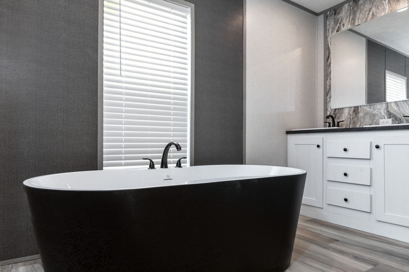 The PLATINUM ANNIVERSARY Primary Bathroom. This Manufactured Mobile Home features 3 bedrooms and 2 baths.