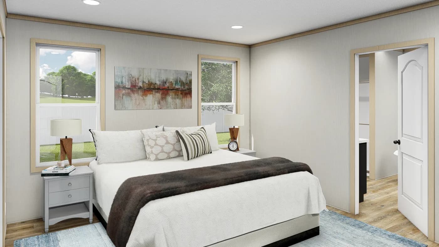 The RICHMOND Primary Bedroom. This Manufactured Mobile Home features 3 bedrooms and 2 baths.