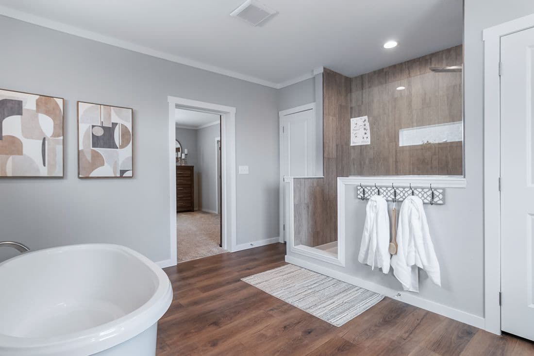 The THE OCEANSIDE Primary Bathroom. This Manufactured Mobile Home features 4 bedrooms and 3 baths.