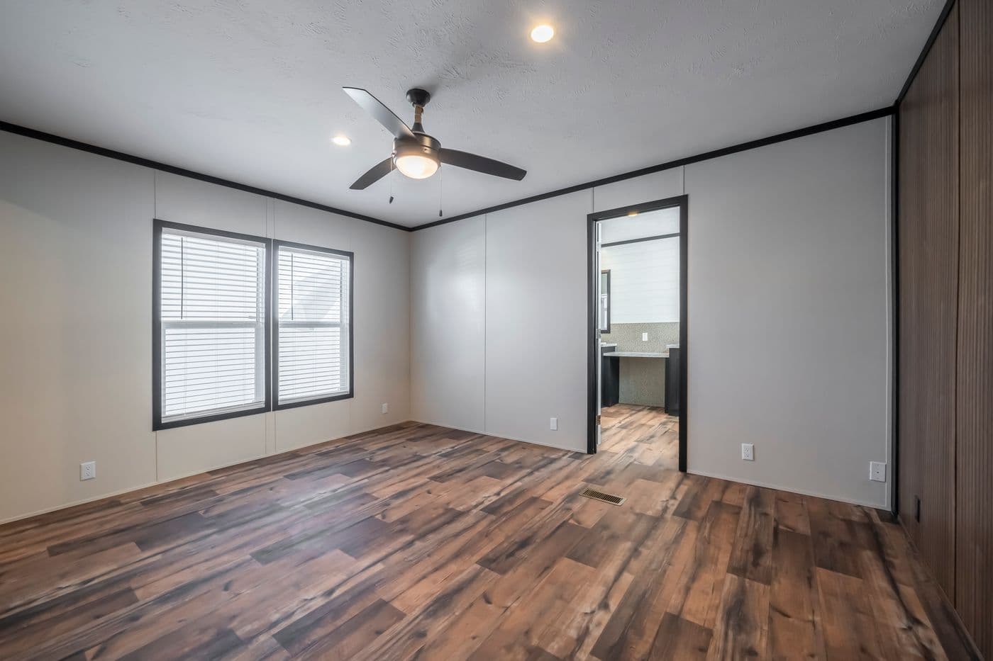 The RAVENWOOD Bedroom. This Manufactured Mobile Home features 3 bedrooms and 2 baths.