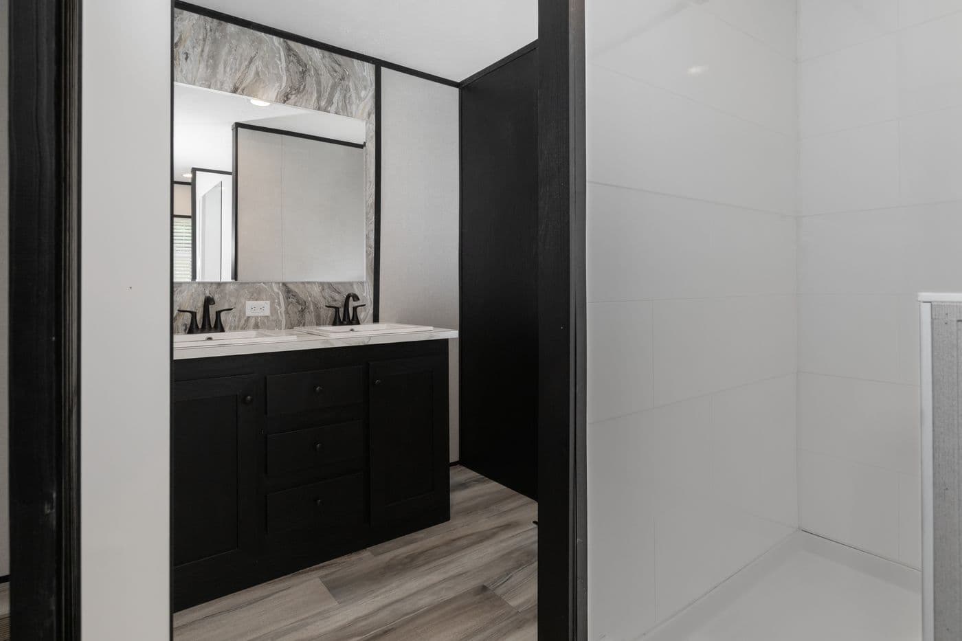 The THE SMOKEY Primary Bathroom. This Manufactured Mobile Home features 3 bedrooms and 2 baths.