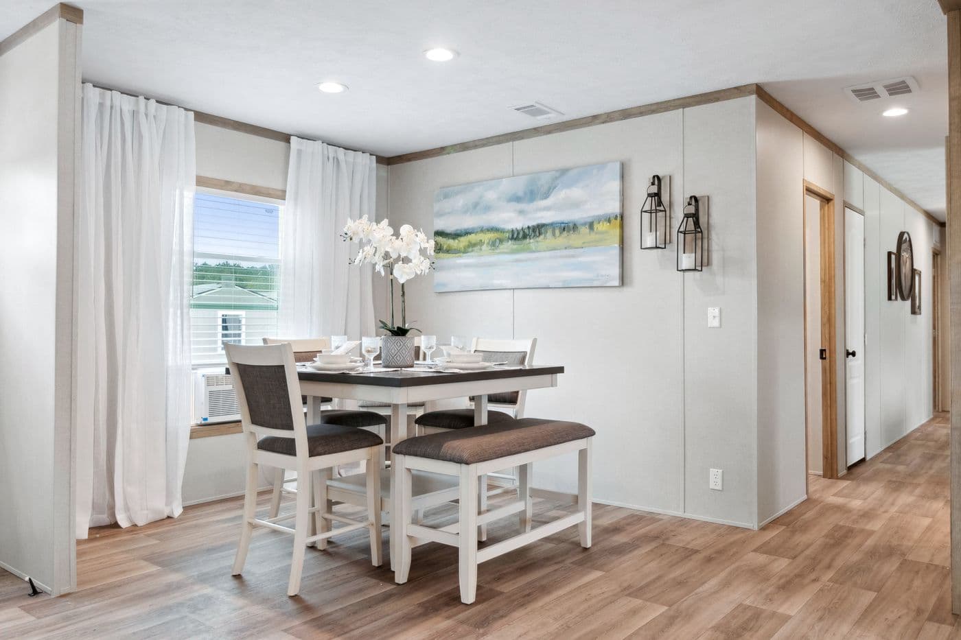 The BREEZE FARMHOUSE 72 Dining Room. This Manufactured Mobile Home features 4 bedrooms and 2 baths.