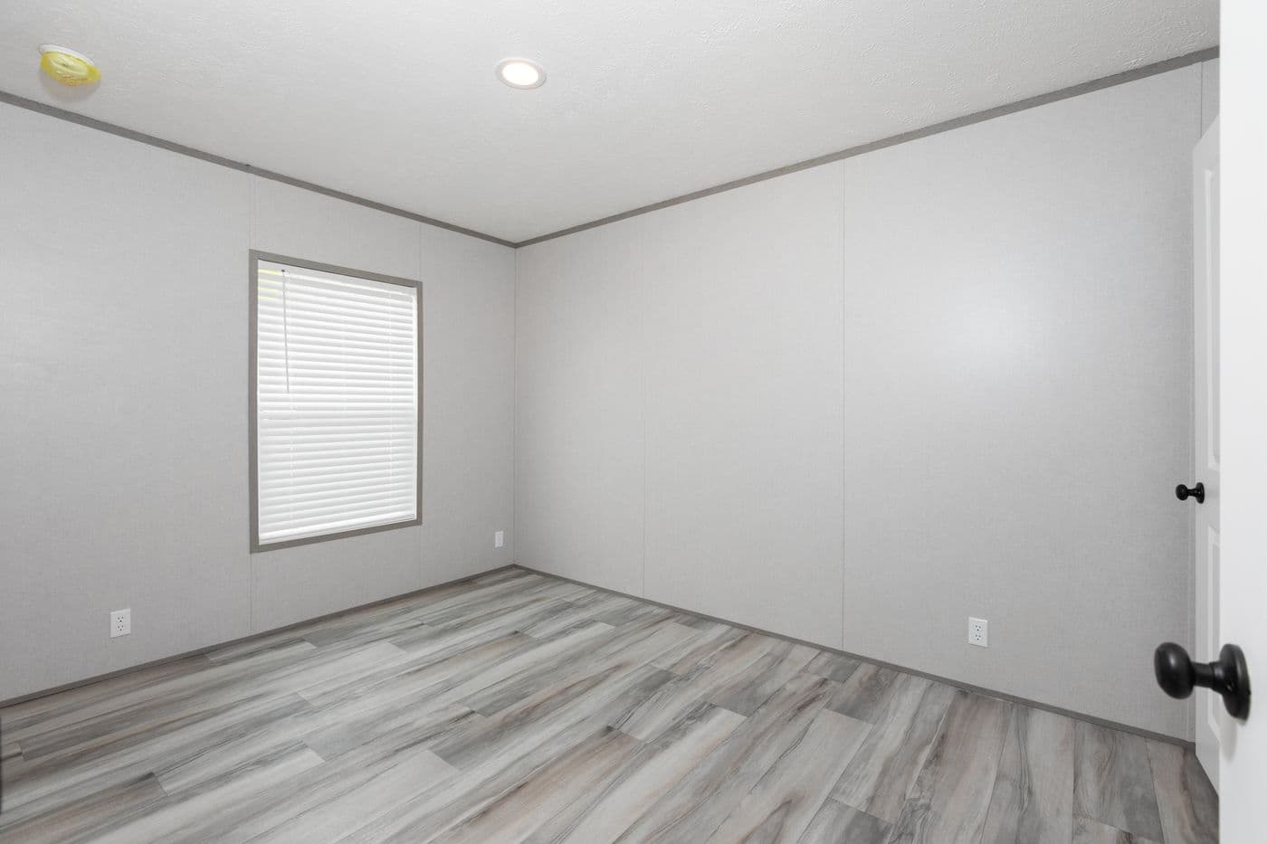 The PLATINUM ANNIVERSARY Guest Bedroom. This Manufactured Mobile Home features 3 bedrooms and 2 baths.