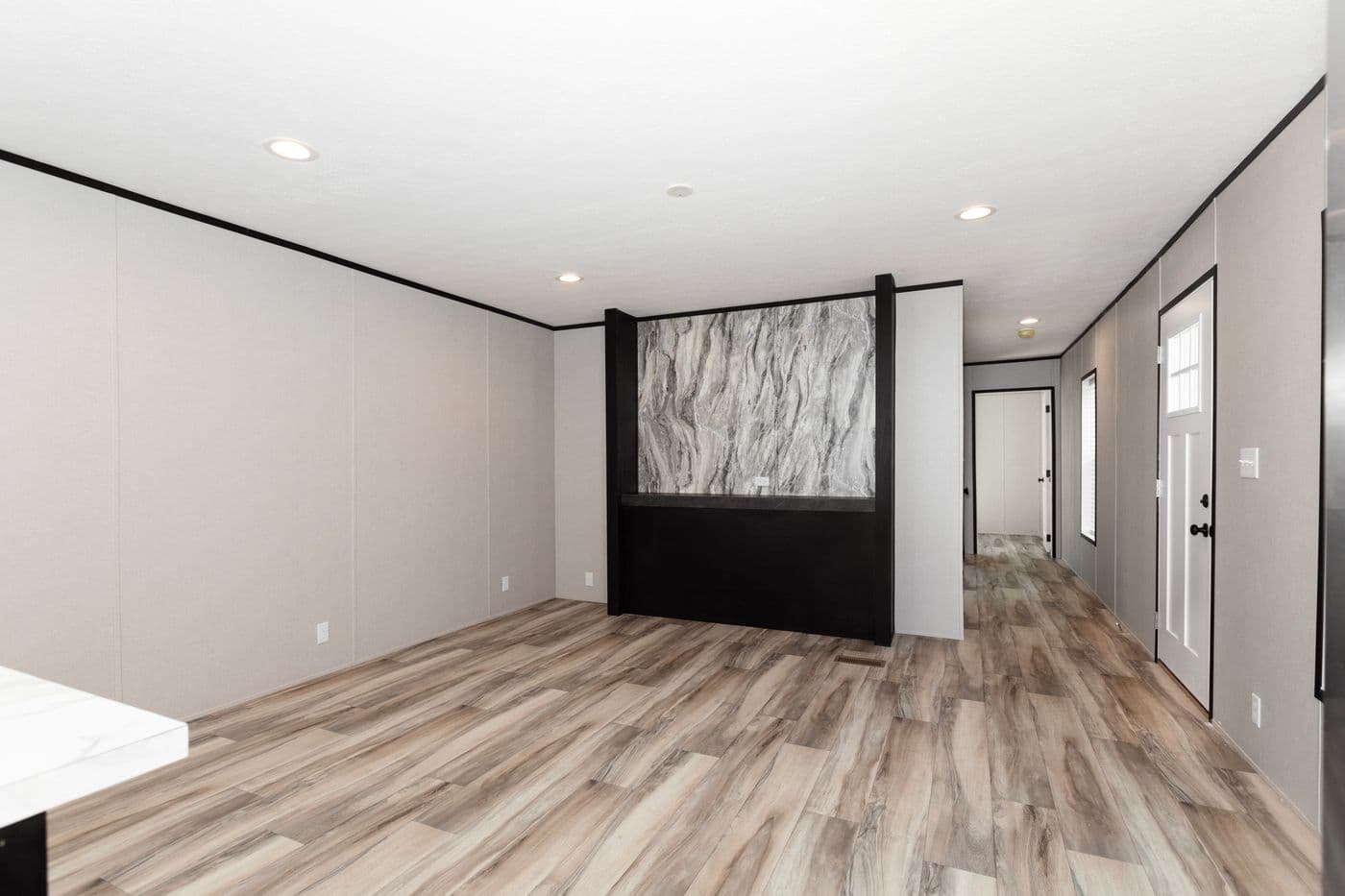 The THE FUJI Living Room. This Manufactured Mobile Home features 3 bedrooms and 2 baths.