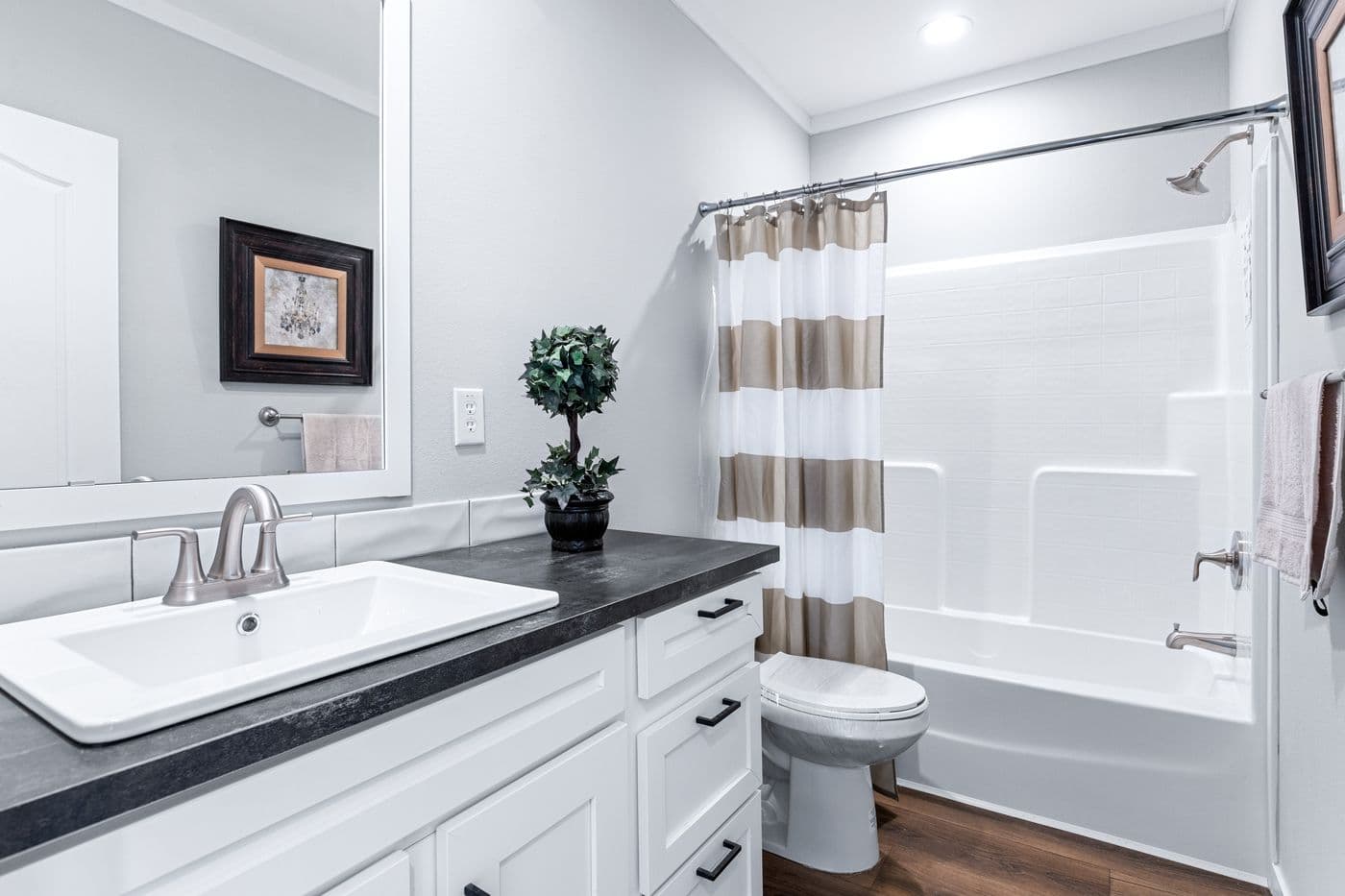 The THE FUJI Guest Bathroom. This Manufactured Mobile Home features 4 bedrooms and 3 baths.
