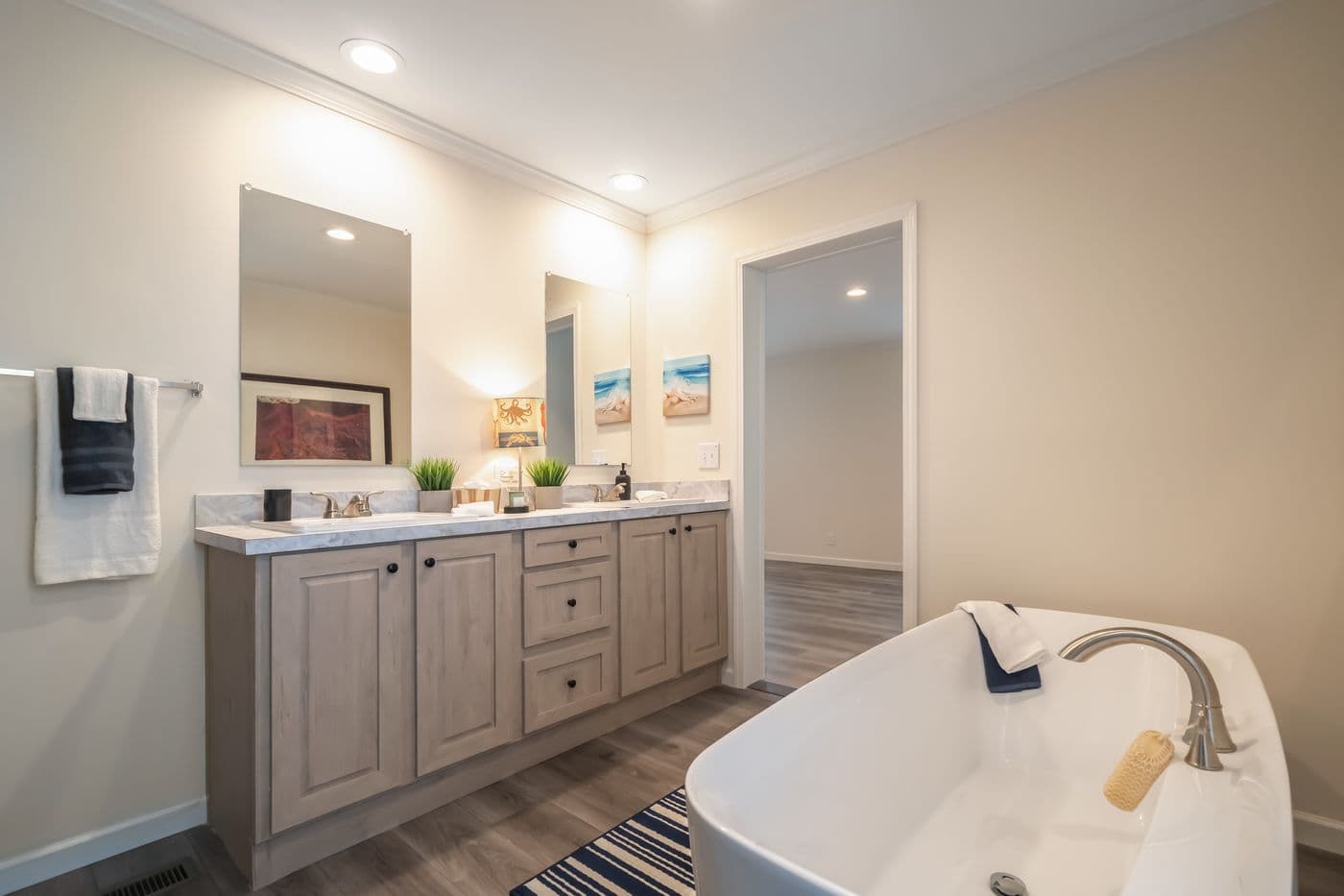 The 4220 "ATLANTIC" 7228 Primary Bathroom. This Manufactured Mobile Home features 3 bedrooms and 2 baths.