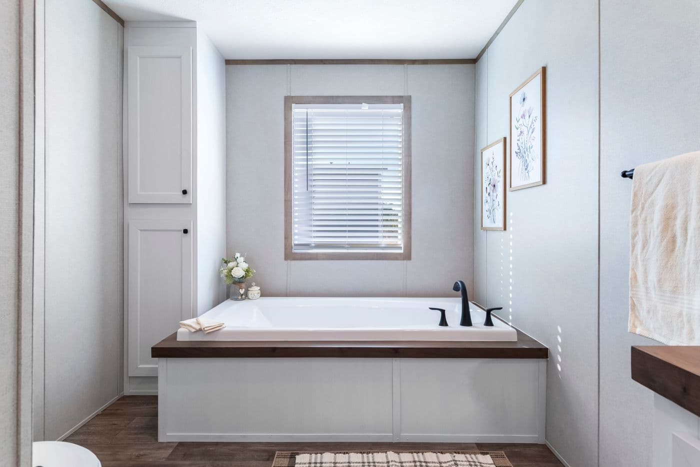 The THE BIG DEAL 52 Primary Bathroom. This Manufactured Mobile Home features 3 bedrooms and 2 baths.