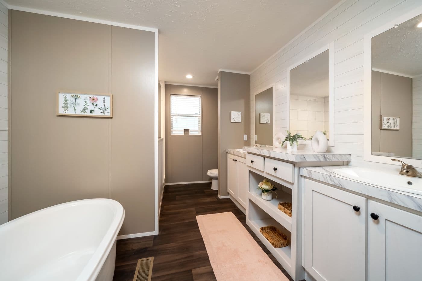 The ISLAND BREEZE 64 Primary Bathroom. This Manufactured Mobile Home features 4 bedrooms and 2 baths.