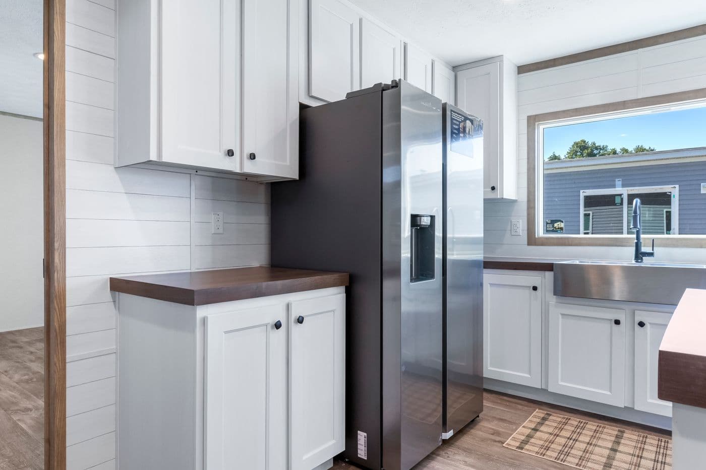 The THE BIG DEAL 52 Kitchen. This Manufactured Mobile Home features 3 bedrooms and 2 baths.