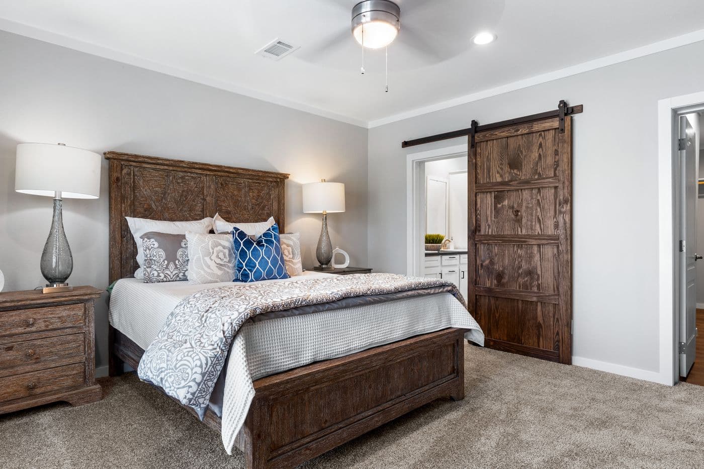 The EL CAPITAN Primary Bedroom. This Manufactured Mobile Home features 3 bedrooms and 2 baths.