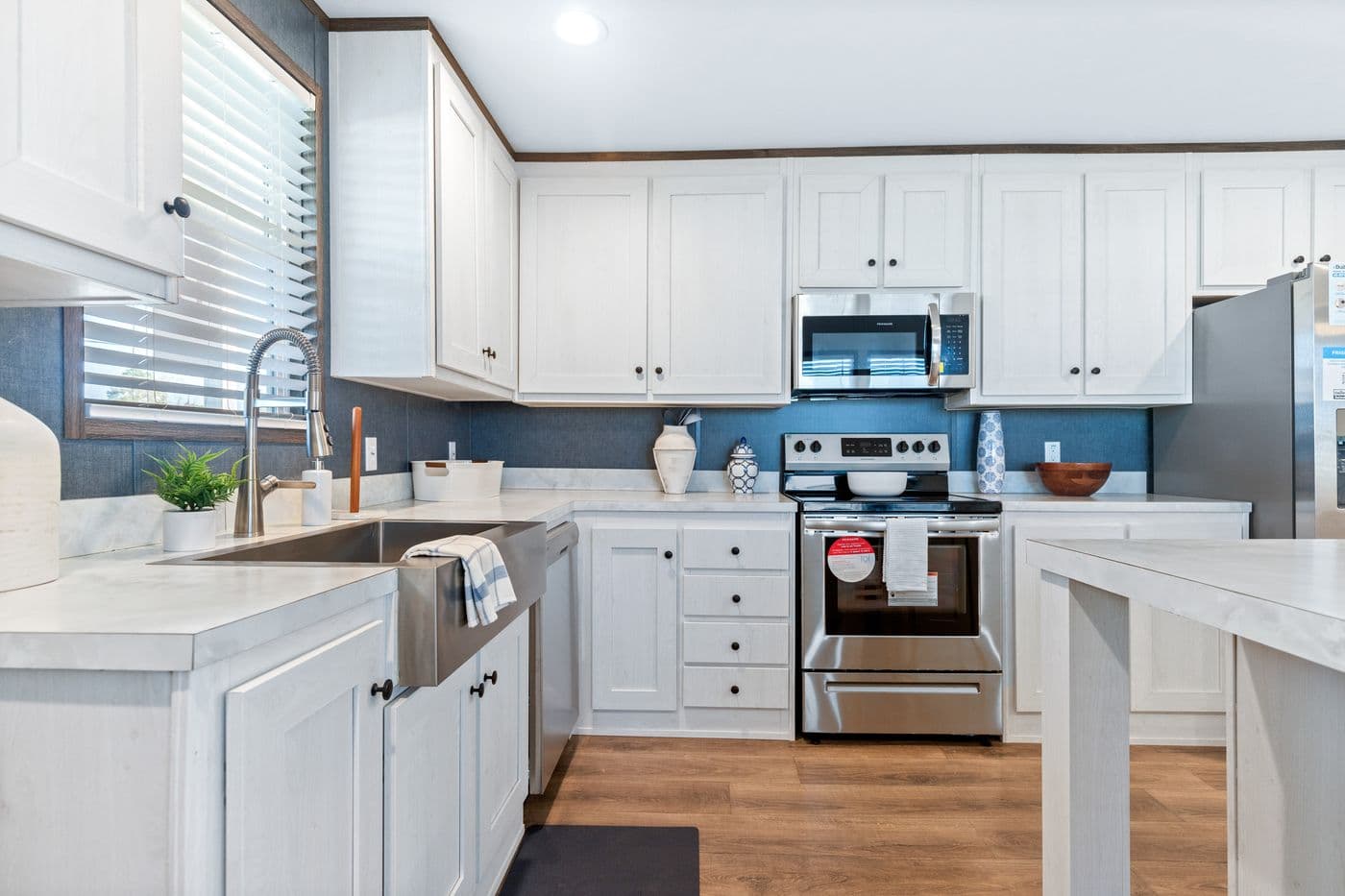 The RETREAT LIVING 16682A Kitchen. This Manufactured Mobile Home features 2 bedrooms and 2 baths.