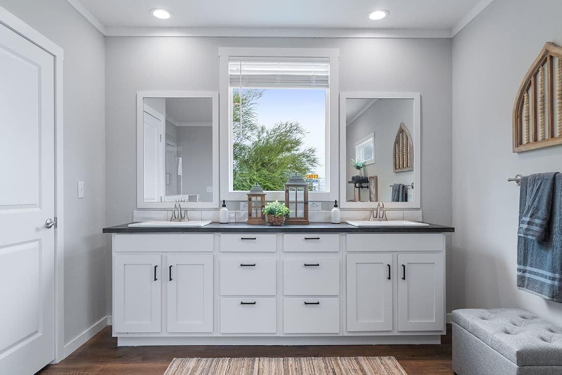 The THE OCEANSIDE Primary Bathroom. This Manufactured Mobile Home features 4 bedrooms and 3 baths.