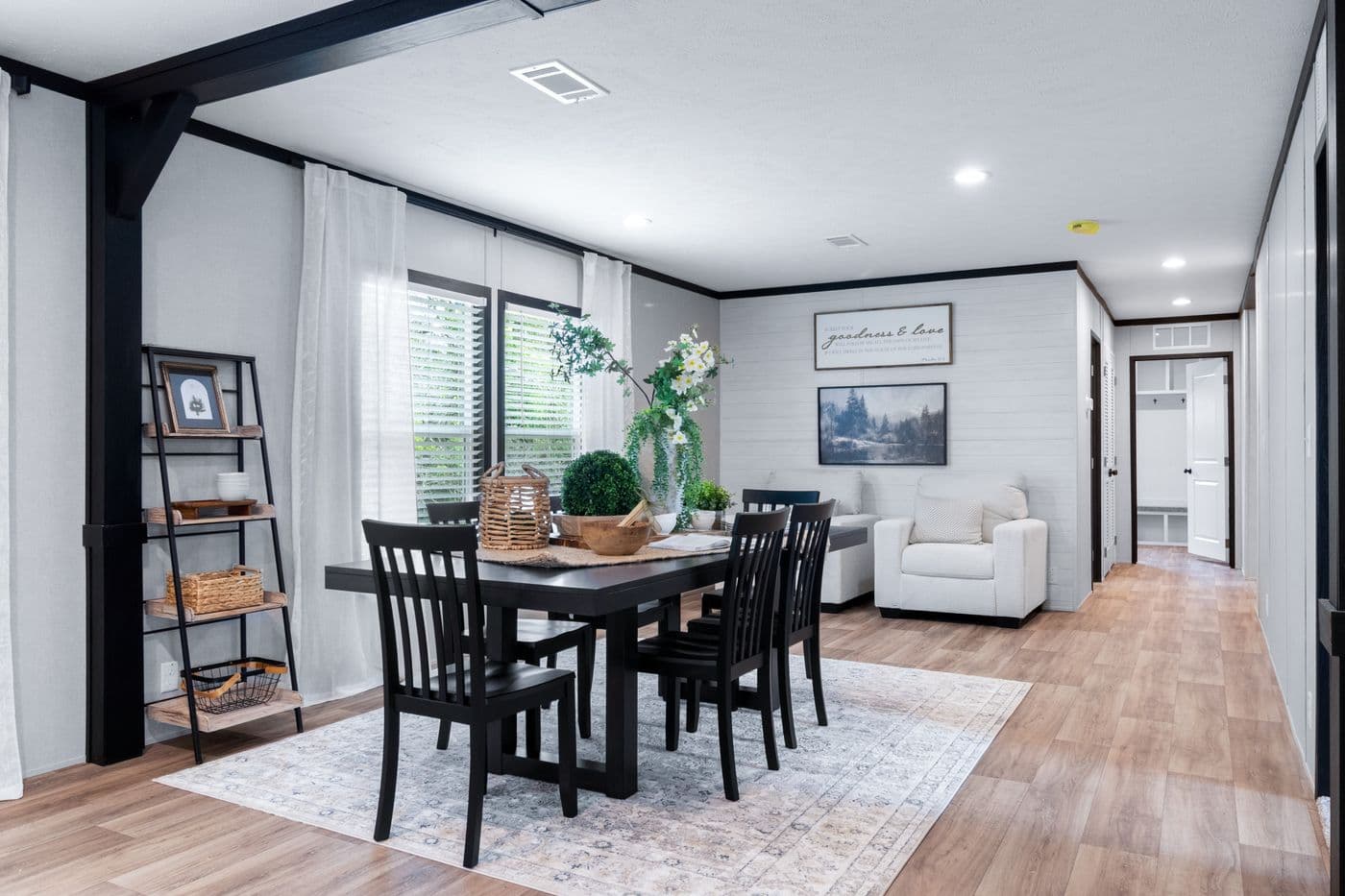 The ABSOLUTE VALUE Dining Area. This Manufactured Mobile Home features 4 bedrooms and 2 baths.