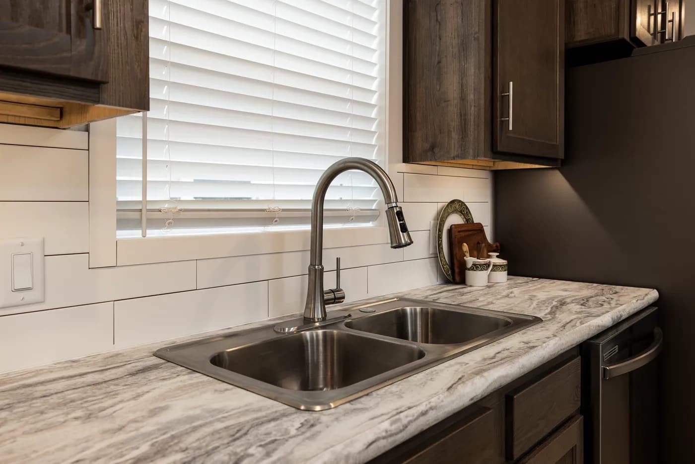 The RAMSEY 217-1 Kitchen. This Manufactured Mobile Home features 3 bedrooms and 2 baths.
