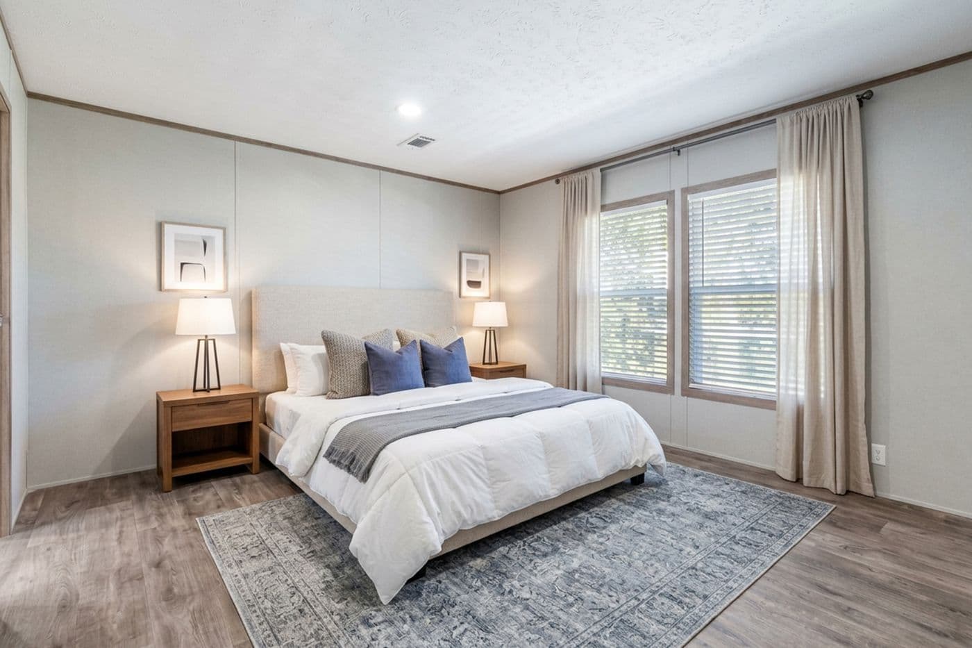 The THE BIG DEAL 52 Primary Bedroom. This Manufactured Mobile Home features 3 bedrooms and 2 baths.
