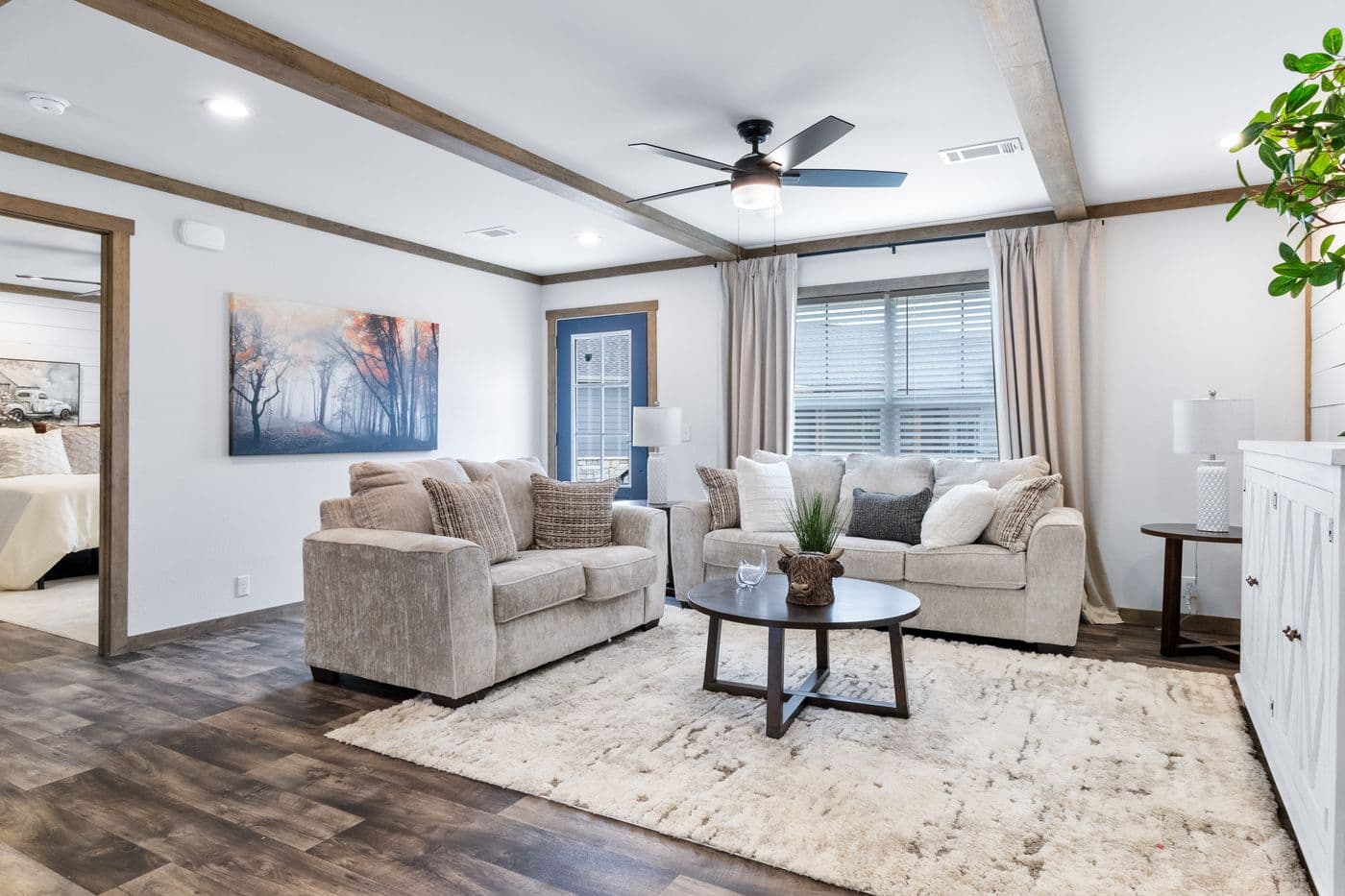 The SAWYER ELITE Living Room. This Manufactured Mobile Home features 3 bedrooms and 2 baths.
