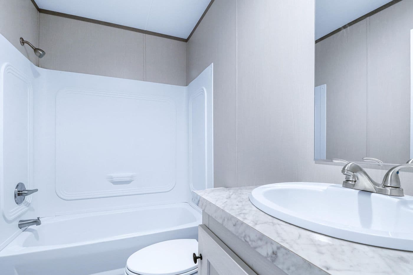 The BREEZE 16723A Guest Bathroom. This Manufactured Mobile Home features 3 bedrooms and 2 baths.