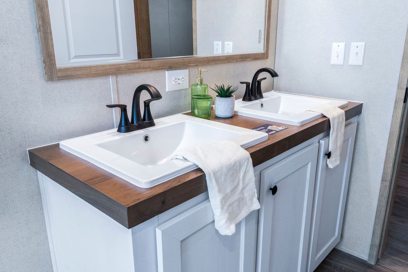 The THE BIG DEAL 52 Primary Bathroom. This Manufactured Mobile Home features 3 bedrooms and 2 baths.