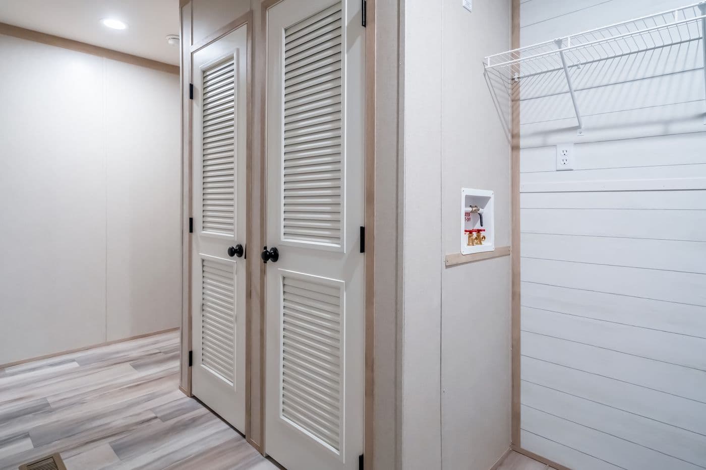 The ANNIVERSARY JEWEL Utility Room. This Manufactured Mobile Home features 3 bedrooms and 2 baths.