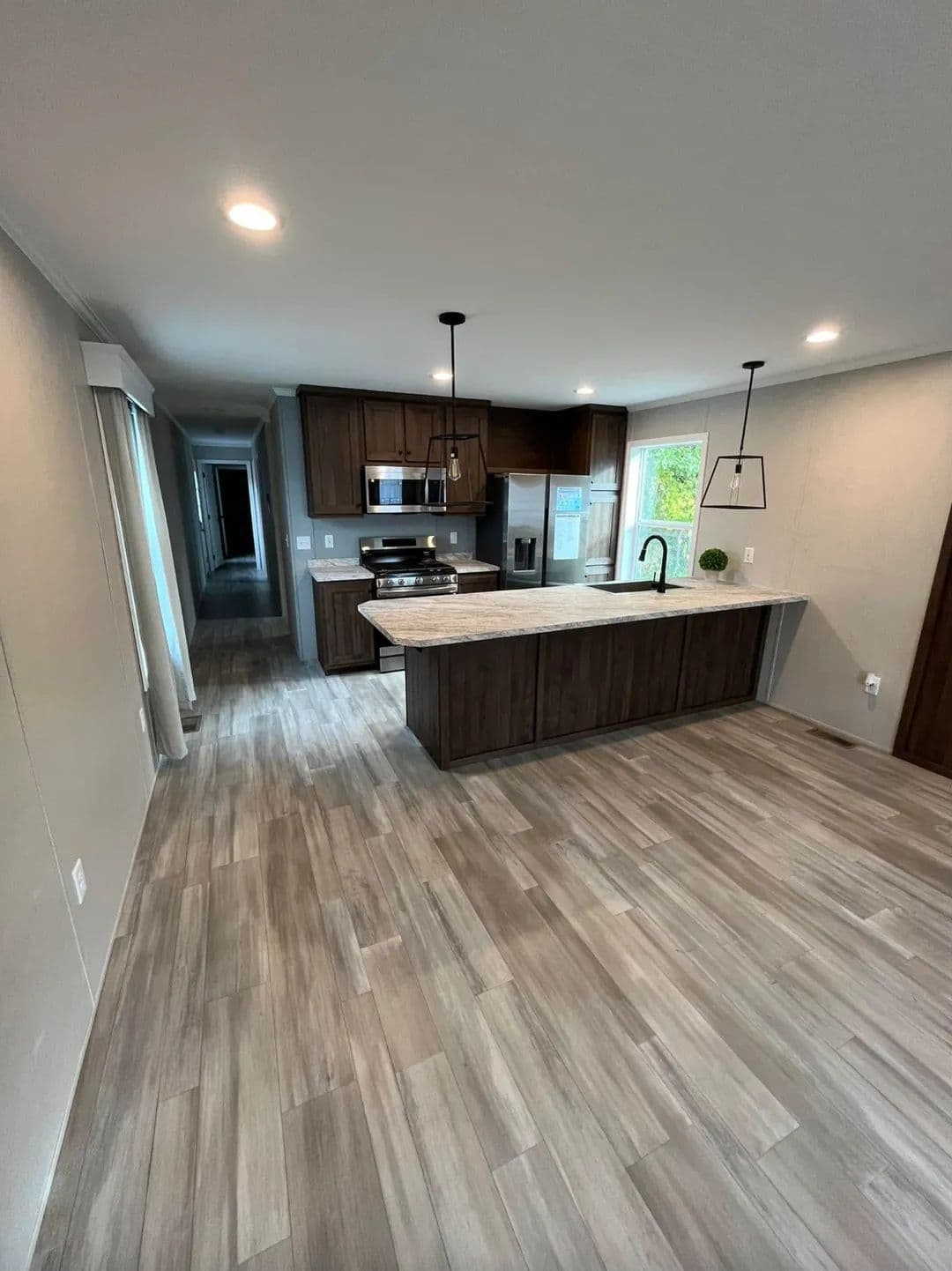 The PERIDOT 60 Living Room. This Manufactured Mobile Home features 2 bedrooms and 2 baths.