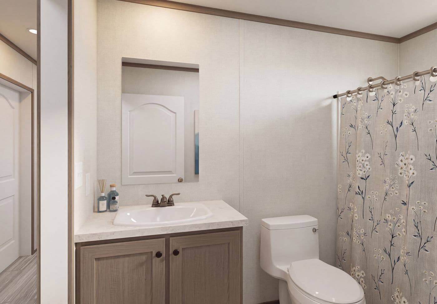 The THE MOUNTAINEER 64 Guest Bathroom. This Manufactured Mobile Home features 3 bedrooms and 2 baths.