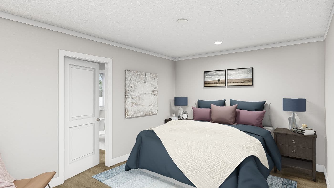 The MOVE ON UP Primary Bedroom. This Manufactured Mobile Home features 3 bedrooms and 2 baths.