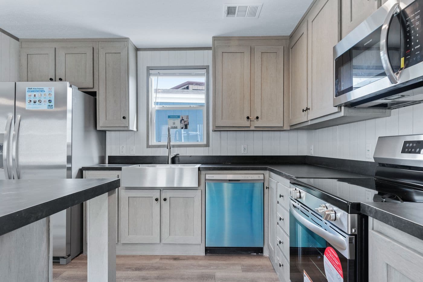 The RESOLUTION 16763H Kitchen. This Manufactured Mobile Home features 3 bedrooms and 2 baths.