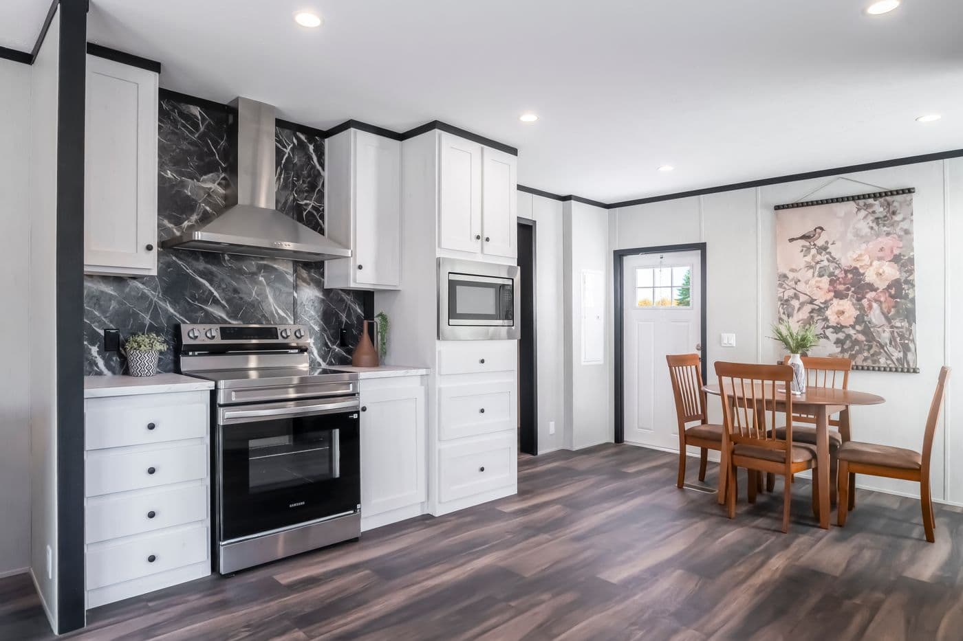 The LIL SOUTHERN CHARM Kitchen. This Manufactured Mobile Home features 3 bedrooms and 2 baths.