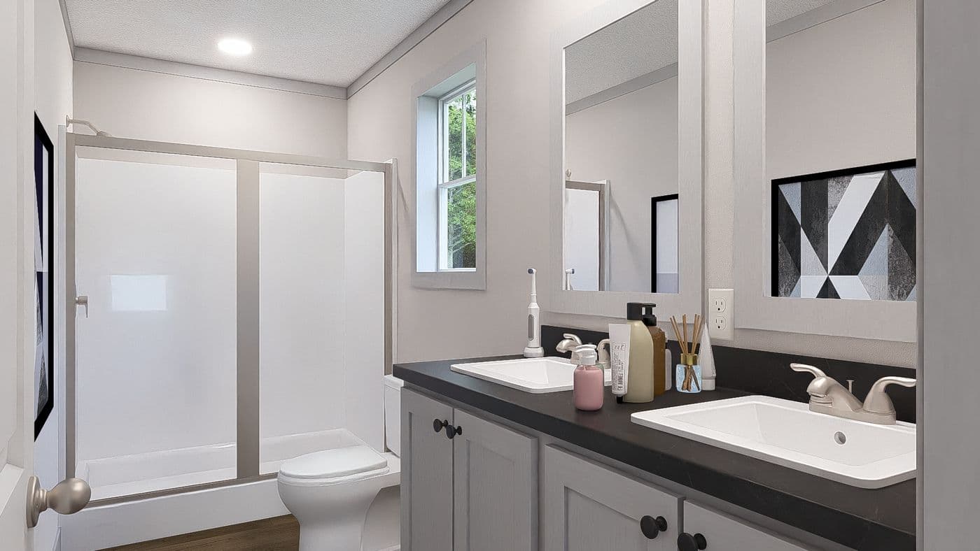The JOHNNY B GOODE Primary Bathroom. This Manufactured Mobile Home features 3 bedrooms and 2 baths.