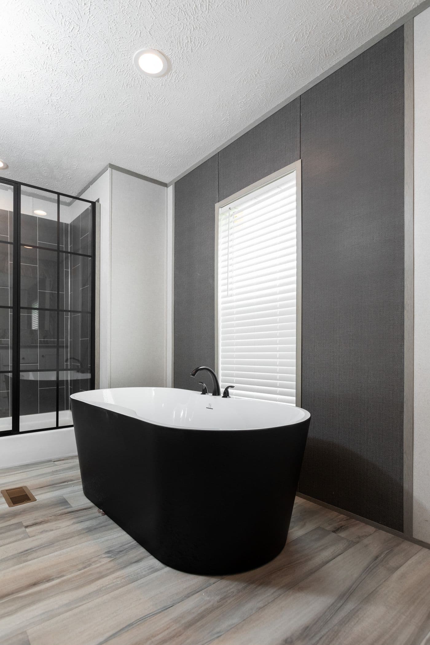 The PLATINUM ANNIVERSARY Primary Bathroom. This Manufactured Mobile Home features 3 bedrooms and 2 baths.