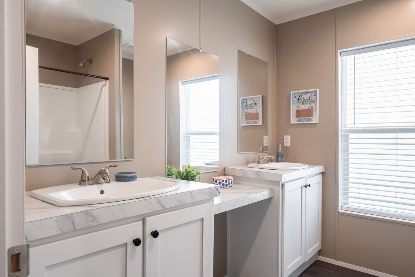 The ISLAND BREEZE 64 Guest Bathroom. This Manufactured Mobile Home features 4 bedrooms and 2 baths.
