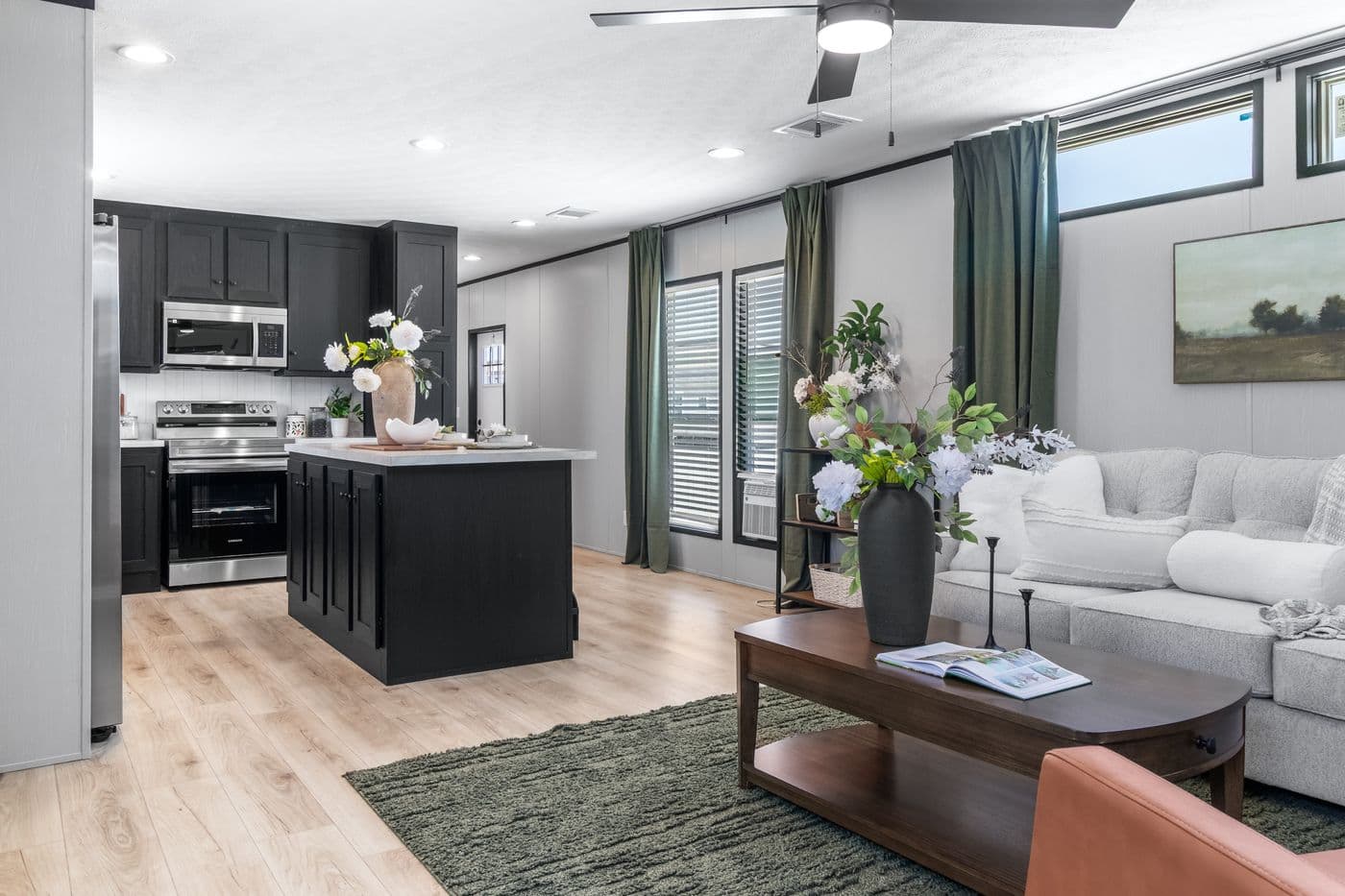 The RESOLUTION 16803B Living Room. This Manufactured Mobile Home features 3 bedrooms and 2 baths.