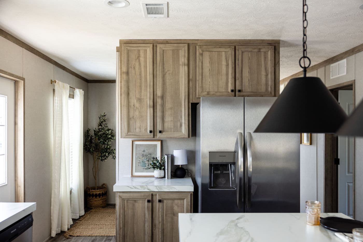 The STERLING ANNIVERSARY Kitchen. This Manufactured Mobile Home features 3 bedrooms and 2 baths.