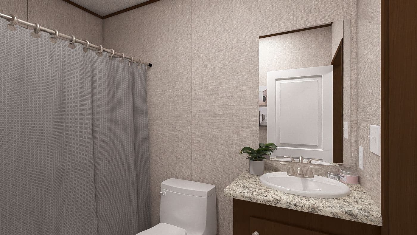 The REDWOOD Guest Bathroom. This Manufactured Mobile Home features 5 bedrooms and 3 baths.