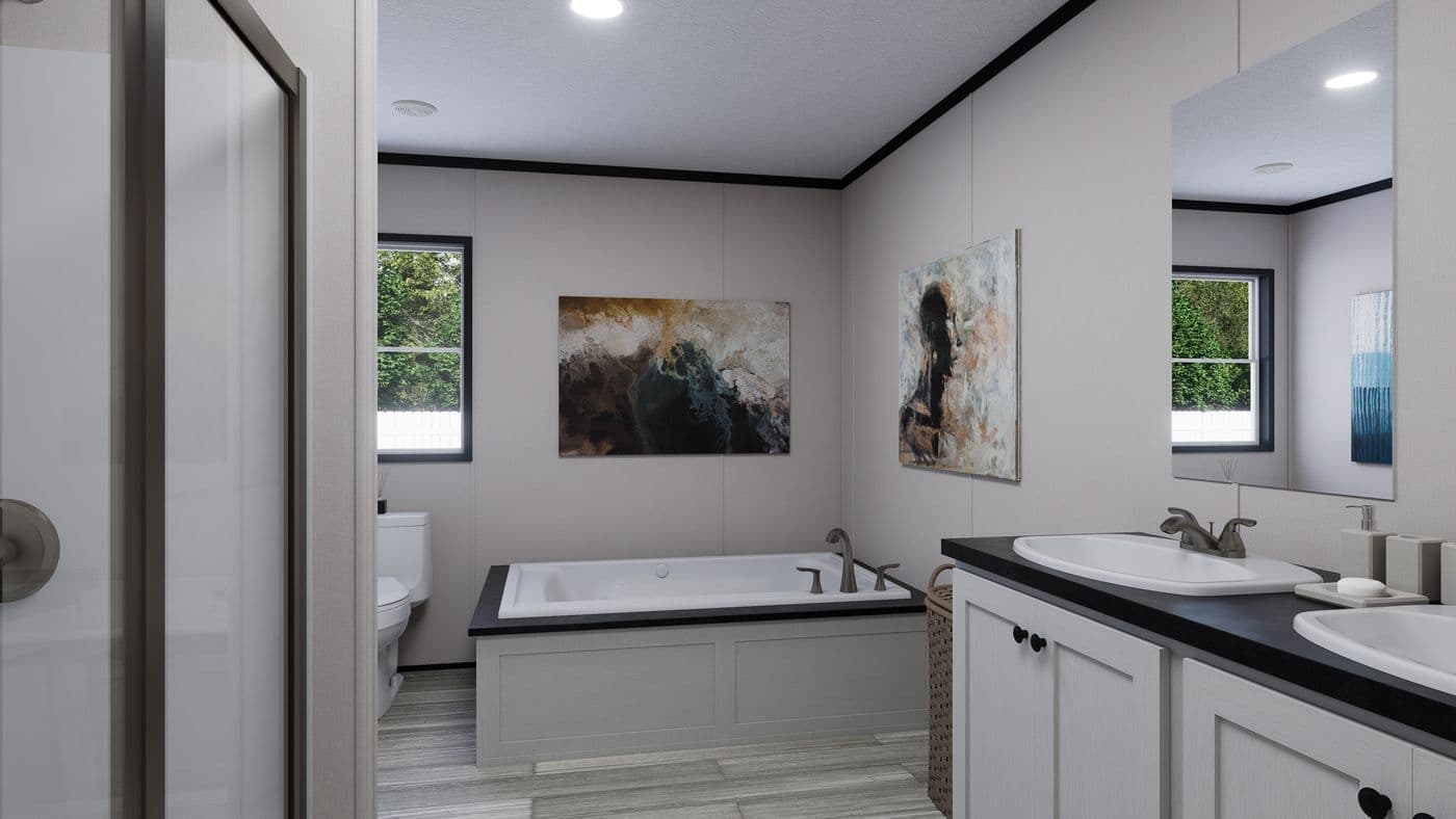 The THE MOUNTAINEER 56 Primary Bathroom. This Manufactured Mobile Home features 3 bedrooms and 2 baths.