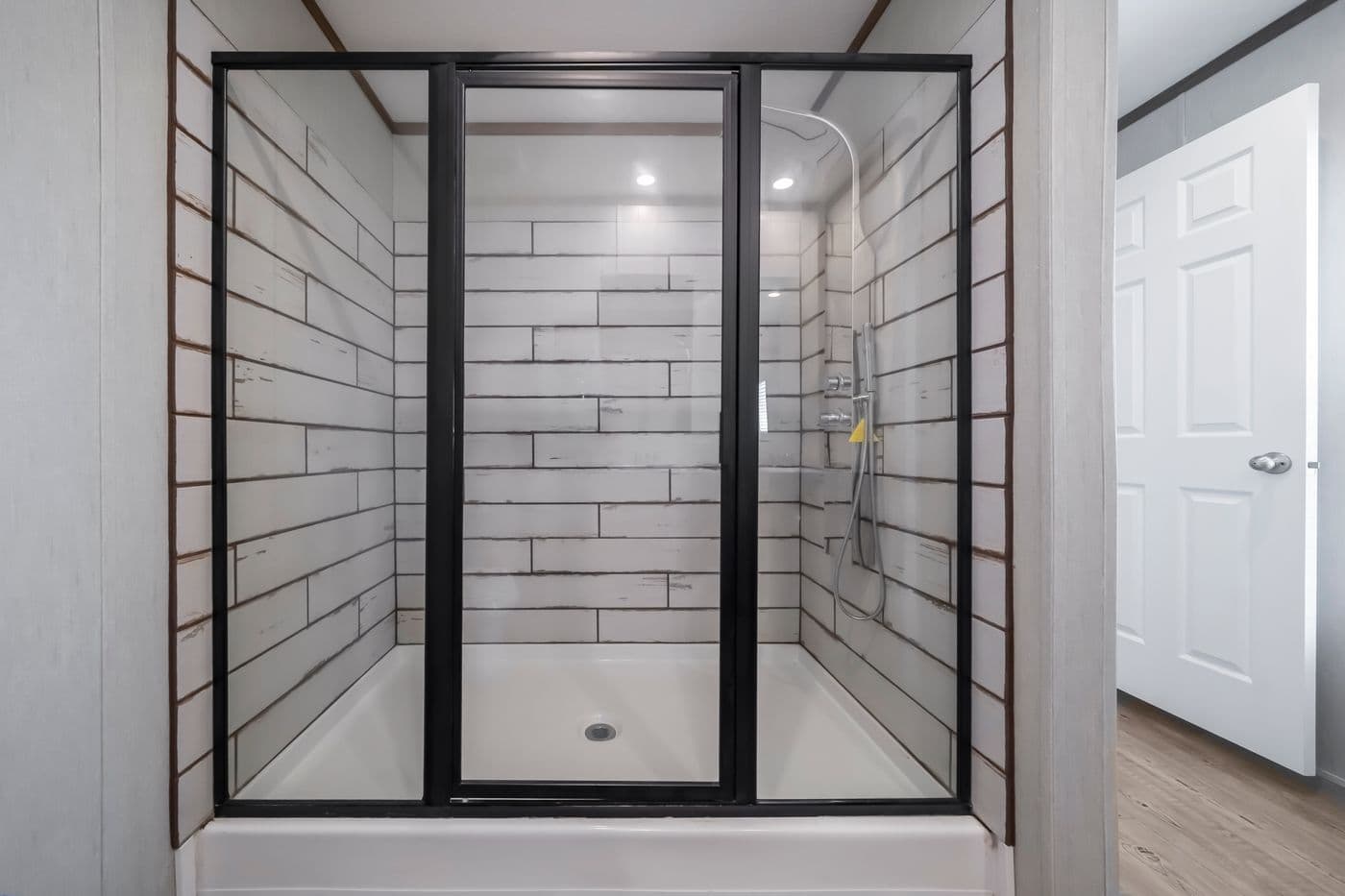 The SEAS THE DAY Primary Bathroom. This Manufactured Mobile Home features 3 bedrooms and 2 baths.