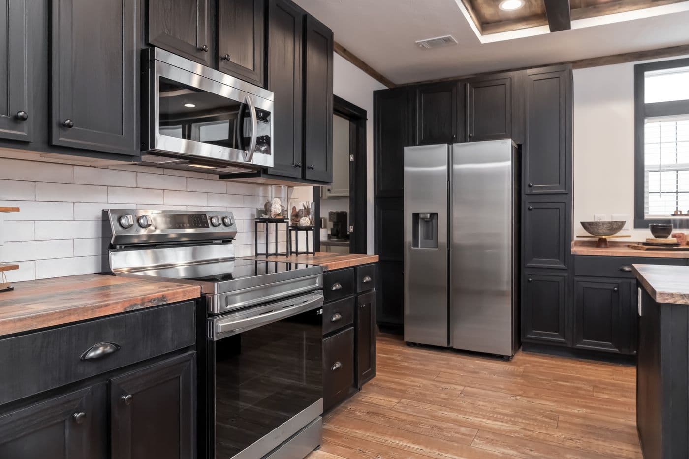 The THE MILL HOUSE Kitchen. This Manufactured Mobile Home features 3 bedrooms and 2 baths.