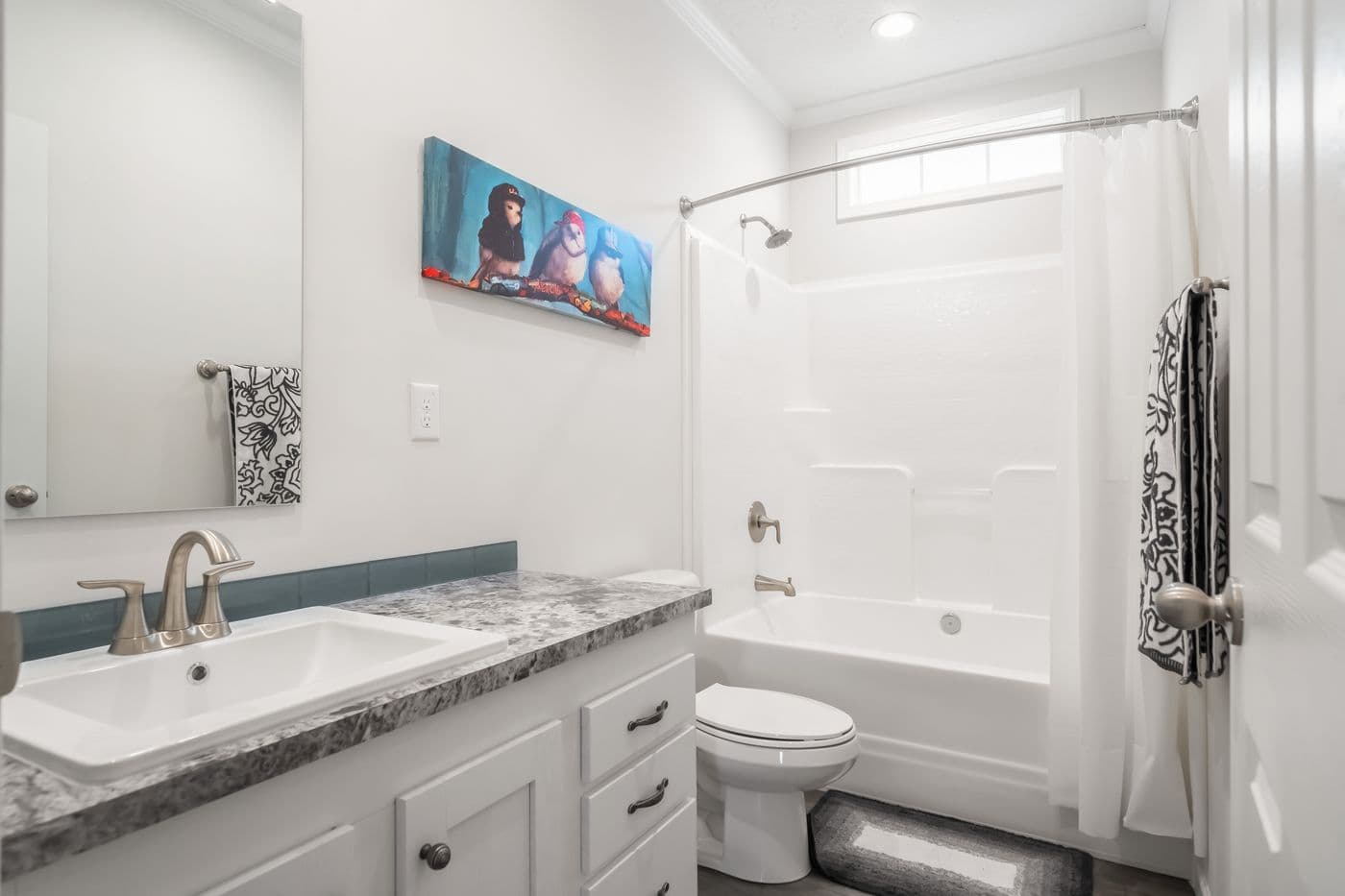 The 3458 MOD 76X32 CAROLINA RAELYN Guest Bathroom. This Modular Home features 4 bedrooms and 3 baths.