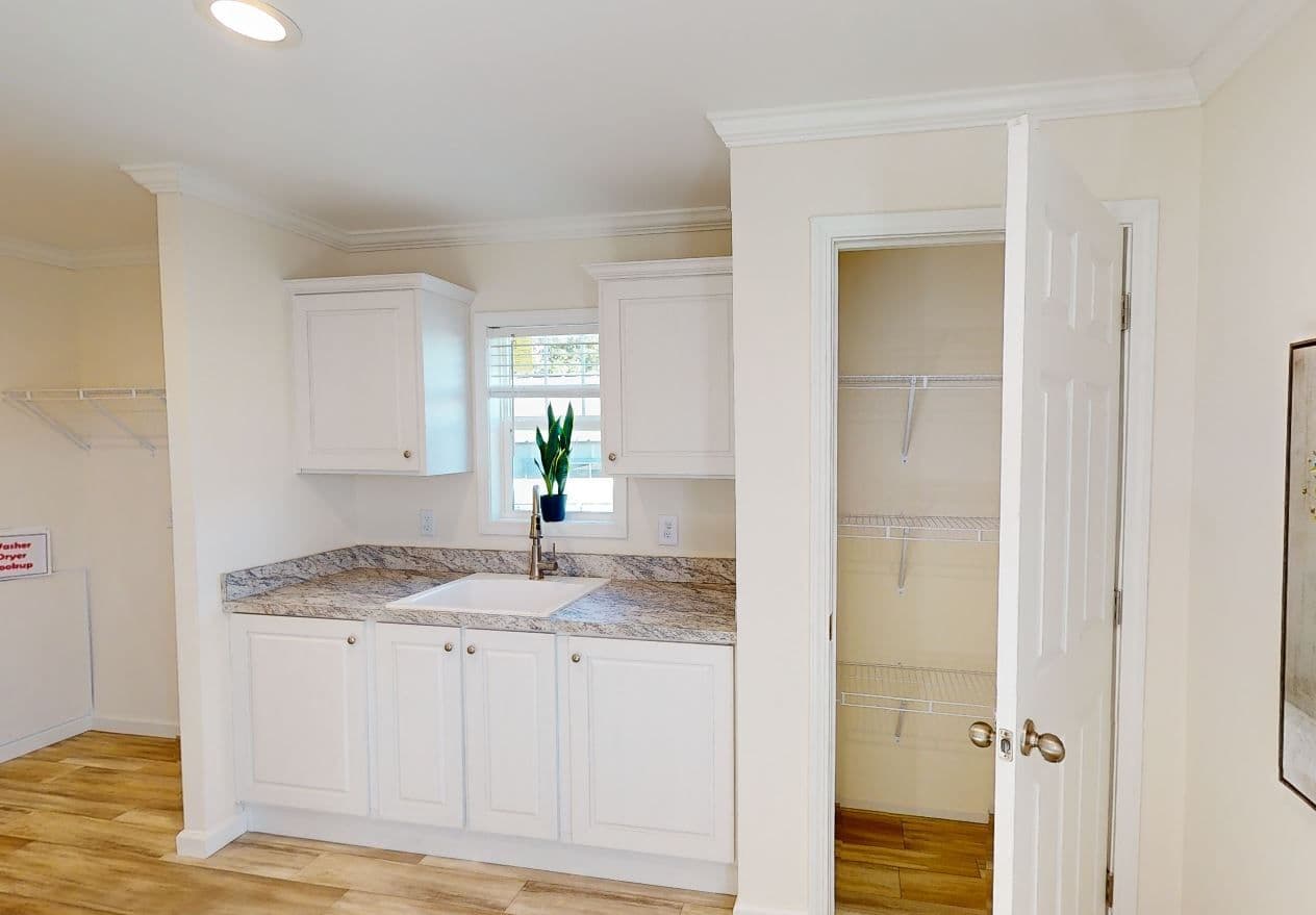 The 4215 "SUNRISE" 6428 Utility Room. This Manufactured Mobile Home features 3 bedrooms and 2 baths.