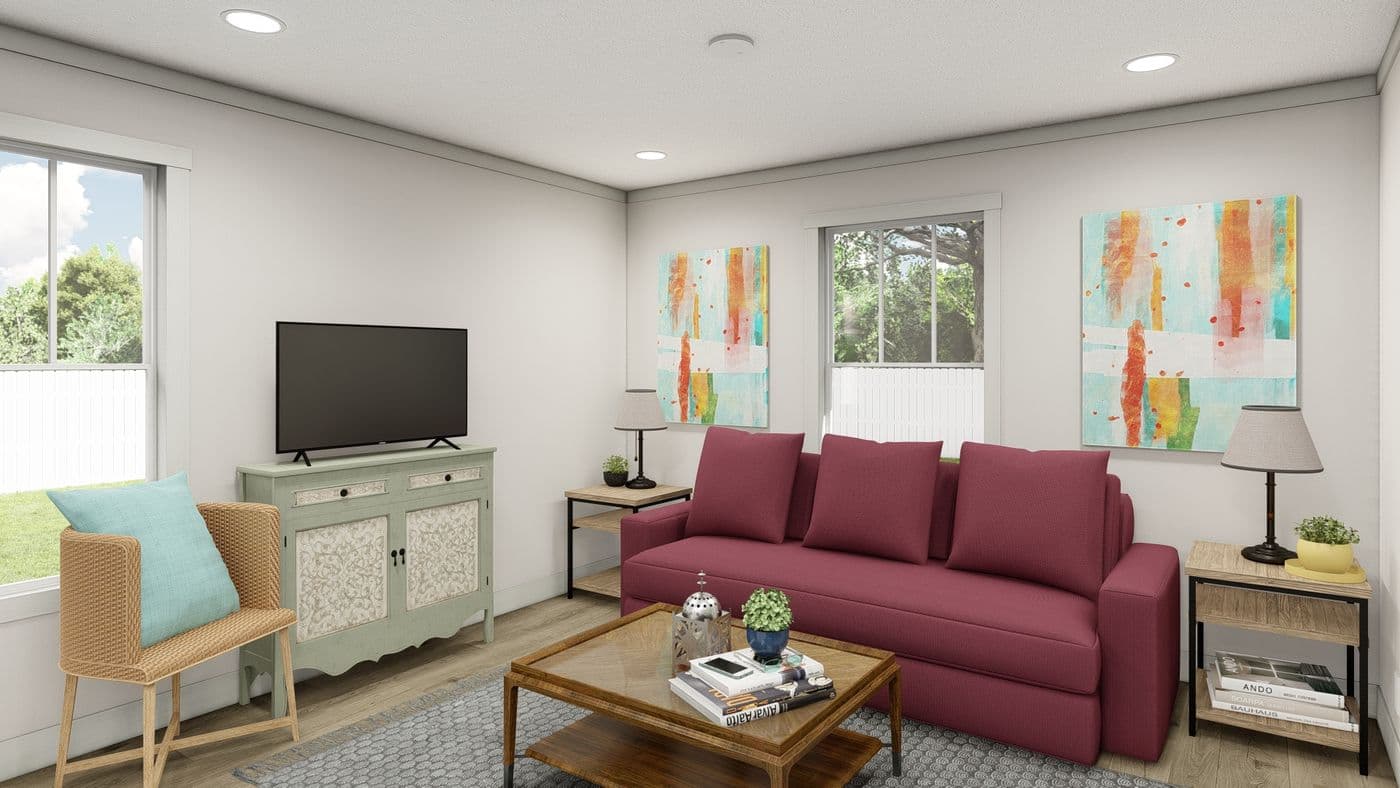 The SATISFACTION Family Room. This Manufactured Mobile Home features 2 bedrooms and 1 bath.