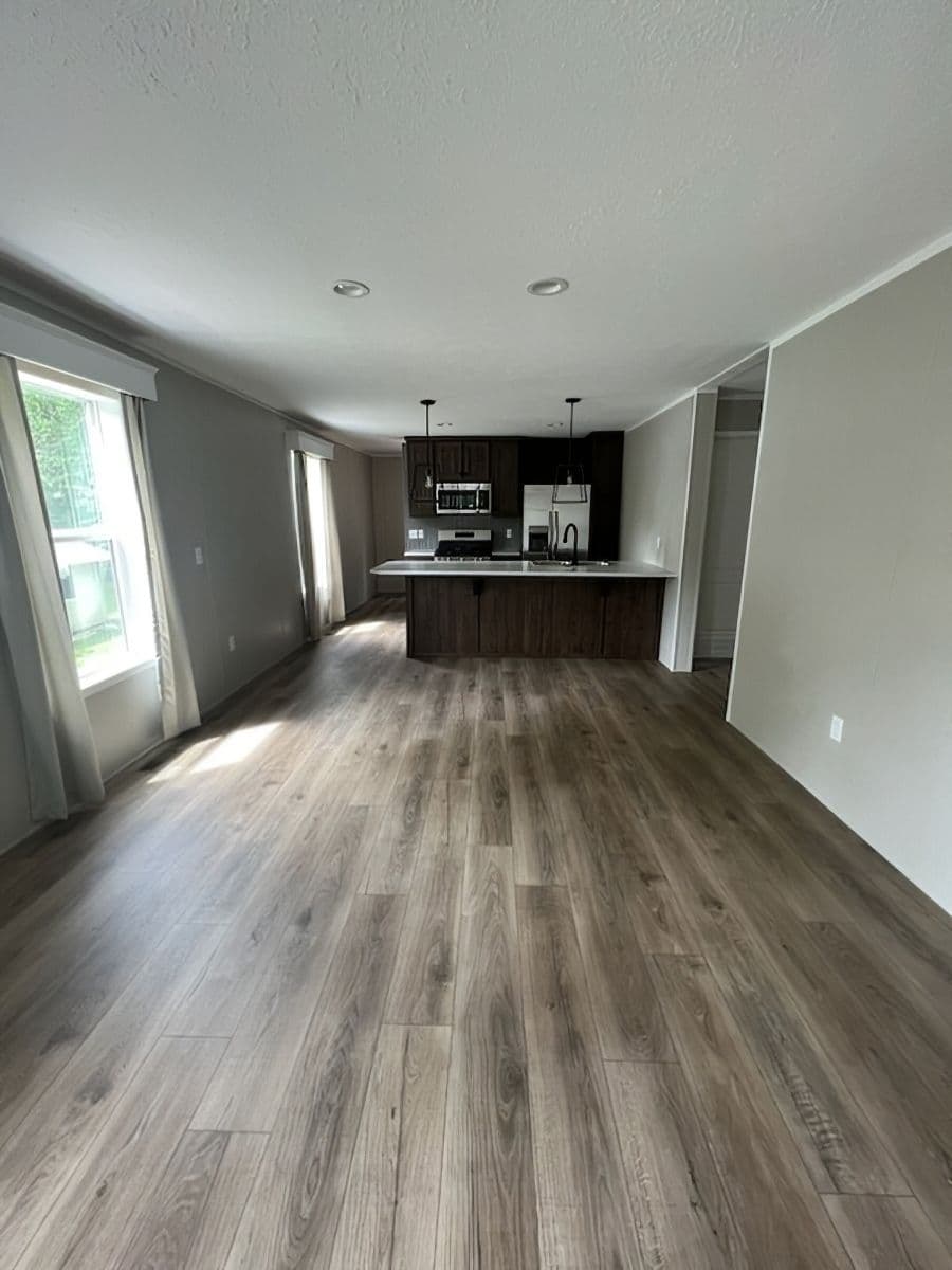 The JADE 40 Living Room. This Manufactured Mobile Home features 2 bedrooms and 2 baths.